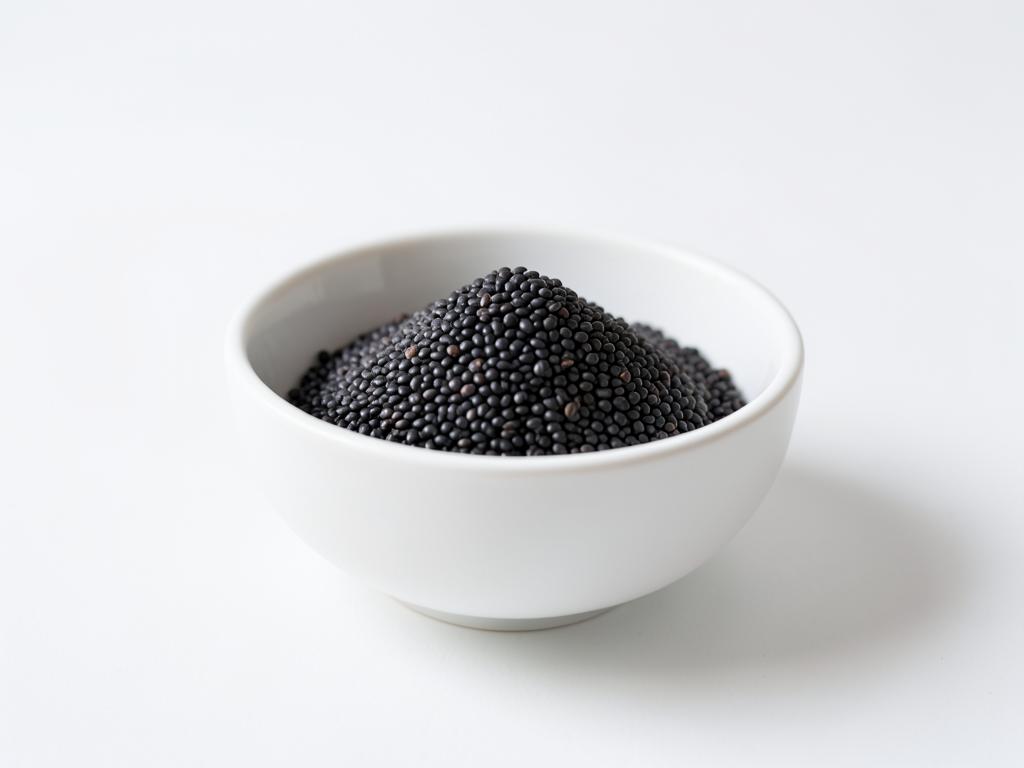 Quinoa negra a granel en tazón blanco, materia prima